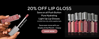 Pure Cosmetics Light Up Lip Gloss collection in multiple shimmering and glossy shades on a black background.
