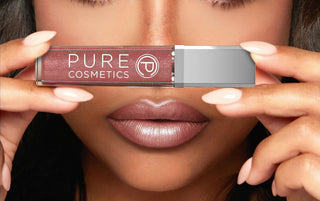 Model wearing Pure Cosmetics Wineberry Light Up Lip Gloss, a soft Bordeaux shimmer shade with LED applicator for effortless fall beauty.