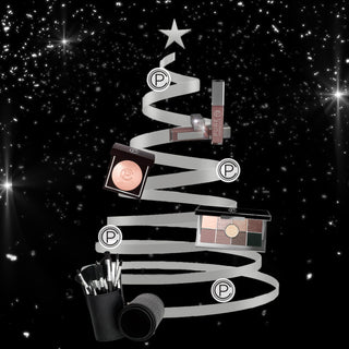 Pure Cosmetics PUREfect Holiday Gift Collection: Velvet Vixen Highlighters, Eyeshadow Palettes, Quilted Brush Set & LED Lip Gloss on Silver Christmas Tree with silver stars on black background