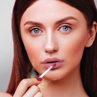 Model with Girl Crush Shade of Hydrating Light Up Lip Gloss