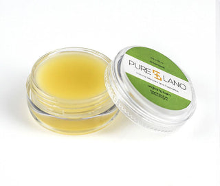 Image showing close-up of Pure Lano ultra-nourishing lip balm formula in a pot for flavor dreamsicle. 