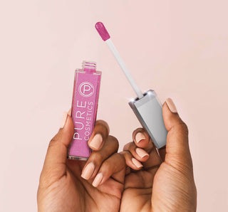 Pouty Pink lip gloss with LED-lit applicator held in hands against light pink background for radiant lip shine.