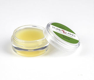 Image showing close-up of Pure Lano ultra-nourishing lip balm formula in a pot for flavor strawberry. 