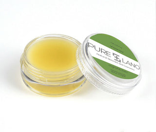 Image showing close-up of Pure Lano ultra-nourishing lip balm formula in a pot for flavor unscented. 