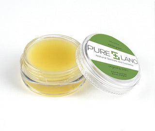 Image showing close-up of Pure Lano ultra-nourishing lip balm formula in a pot for flavor wintergreen. 